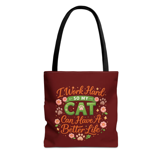 Red tote bag with humorous text and cat-themed graphics on a white background