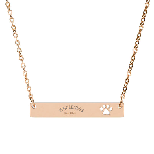 Rose gold necklace with 'WHOLENESS' and cute cat-paw print design on a white background