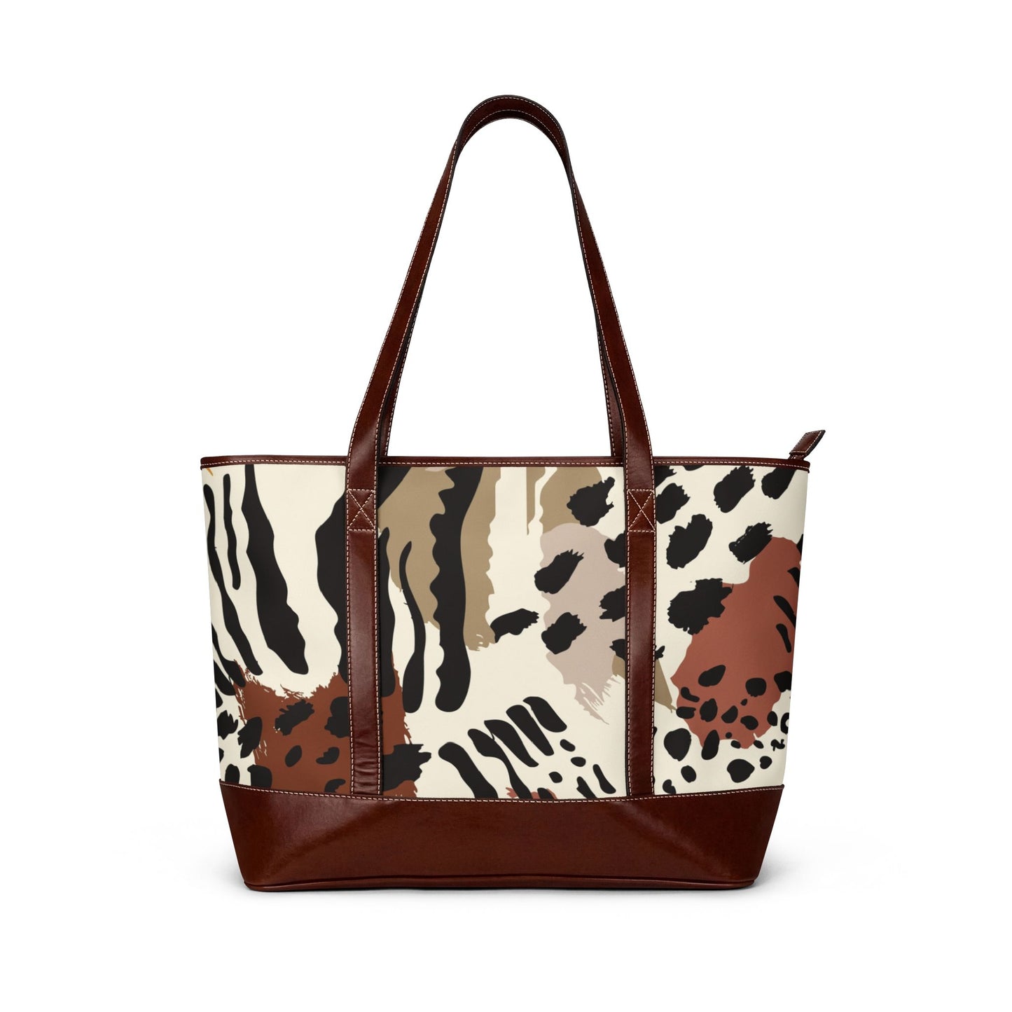 Large tote bag with a mixed animal print design in neutral tones, featuring brown shoulder straps and a wide brown base, shown against a plain background.